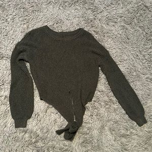 Green sweater with tie in front